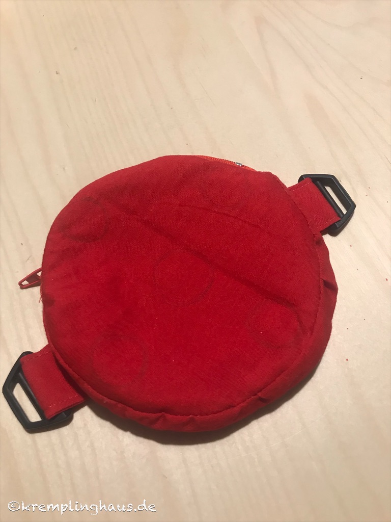 Kleine runde rote Tasche